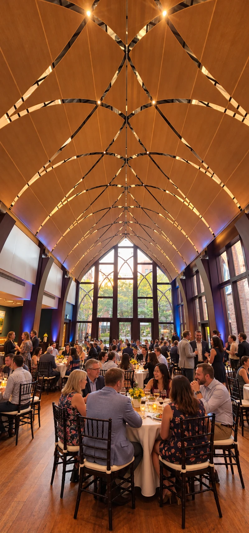 Illustration of the same event room filled with guests socializing around tables